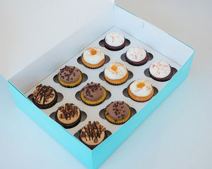 Our Vintage Cupcake Assortment features red velvet and chocolate peanut butter cupcakes. Only available at House of Clarendon in Lancaster, PA.